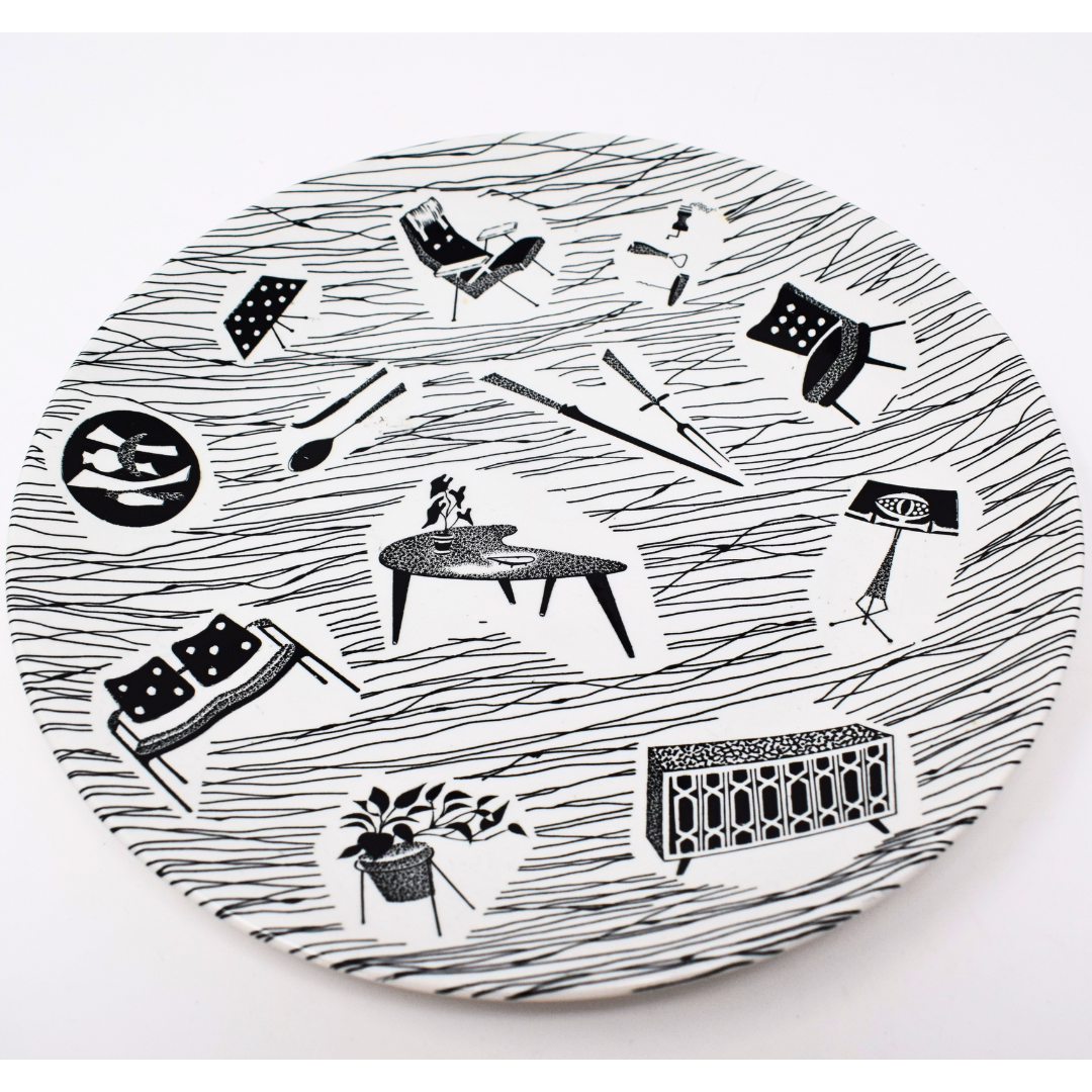 Round plate with black and white line art design on a white background