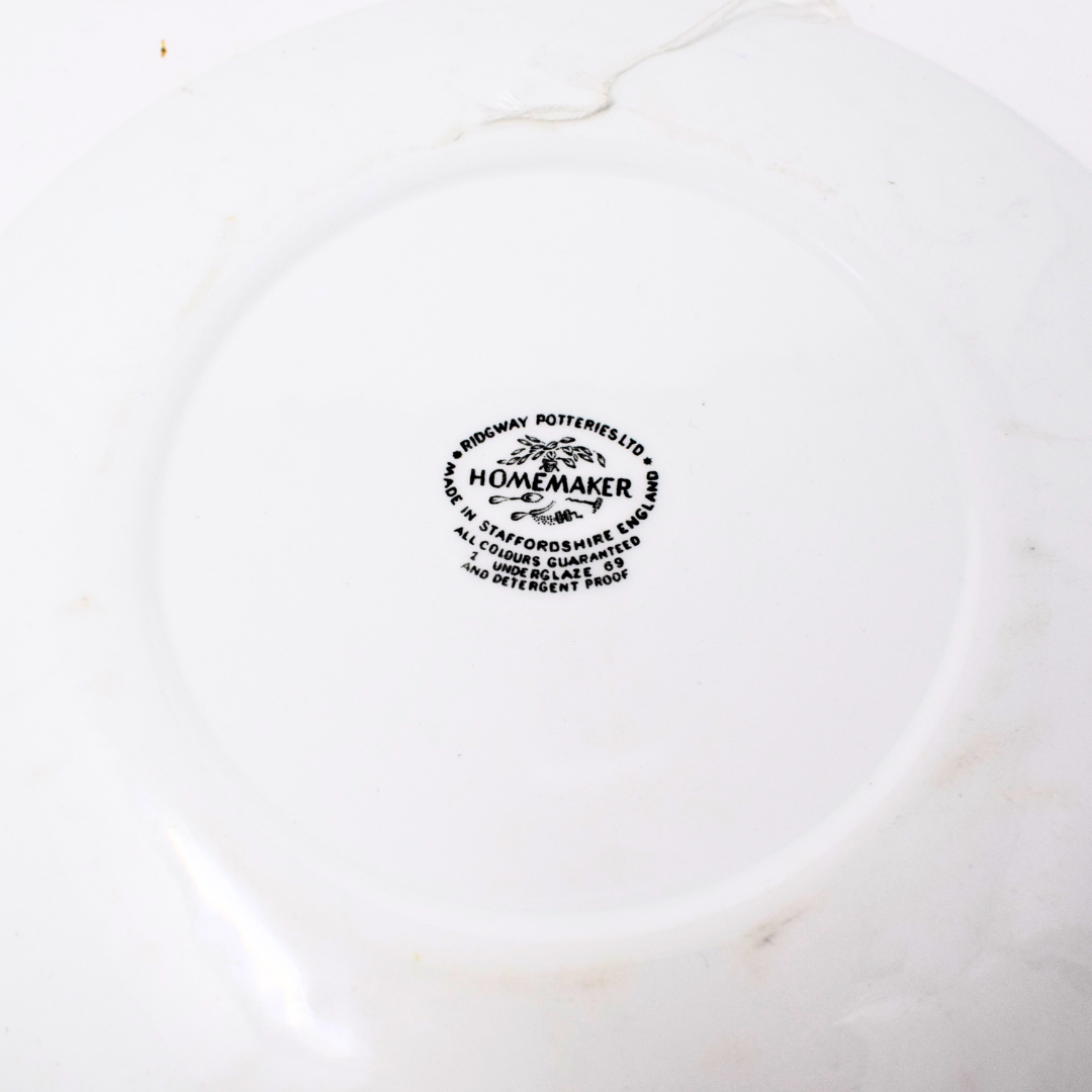 White ceramic plate with 'Homemaker' branding on a white background