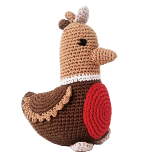 Crocheted toy resembling a bird with a red body and brown wings on a white background