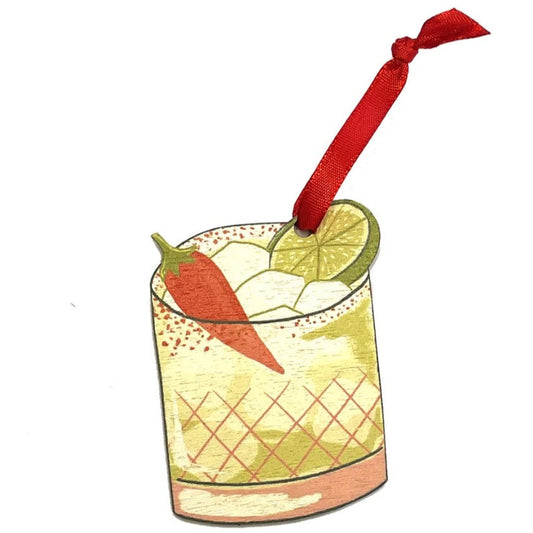 Illustration of a cocktail with a carrot and lime garnish on a white background