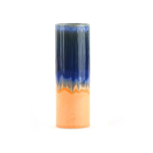 Cylindrical vase with blue top and orange bottom on a white background