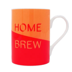 Mug with half orange and half red background separated diagonally, with words Home in red and Brew in orange. Also has white handle. 