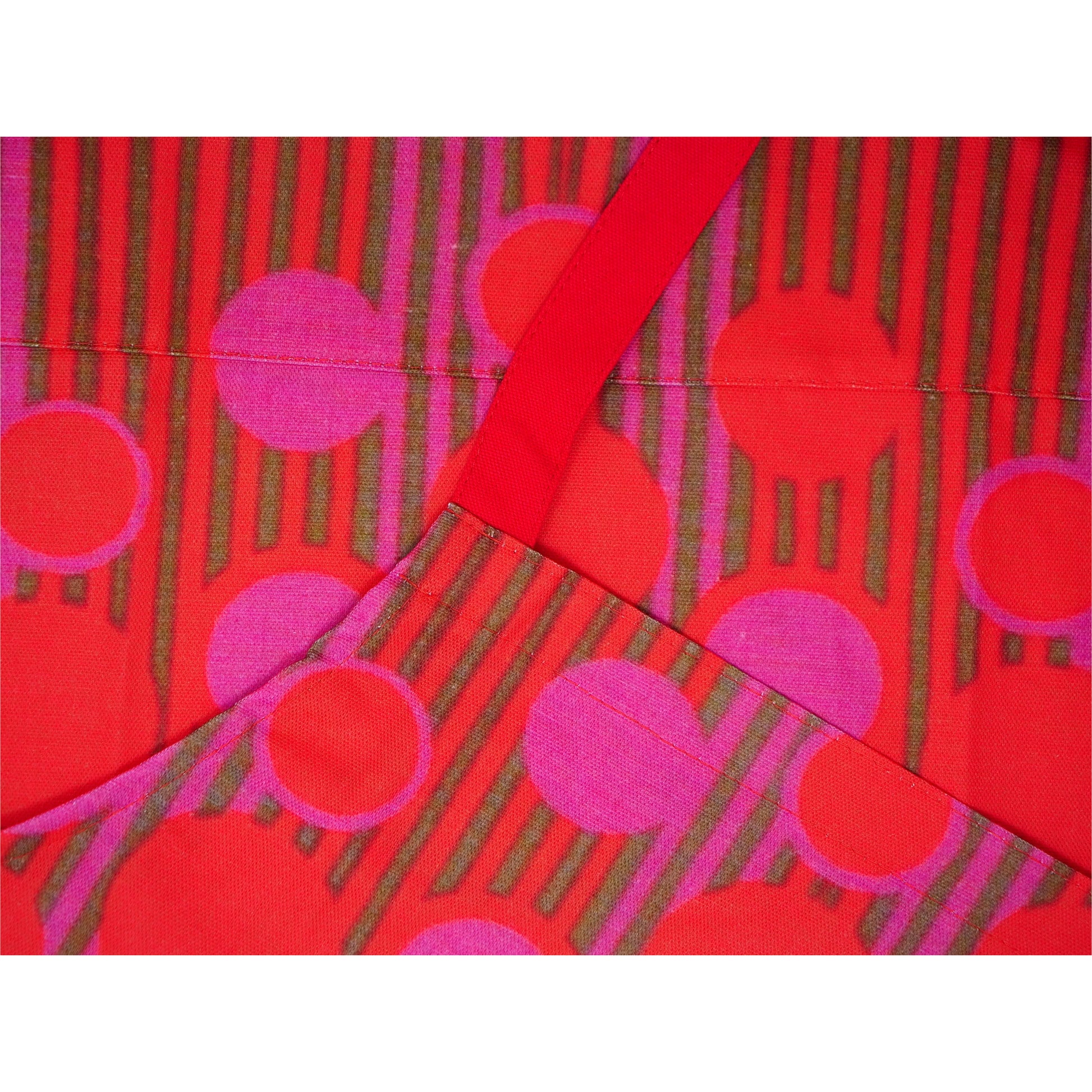 Close up of apron including strap.