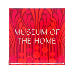 Square, red patterned magnet with Museum of the Home logo written in white. 
