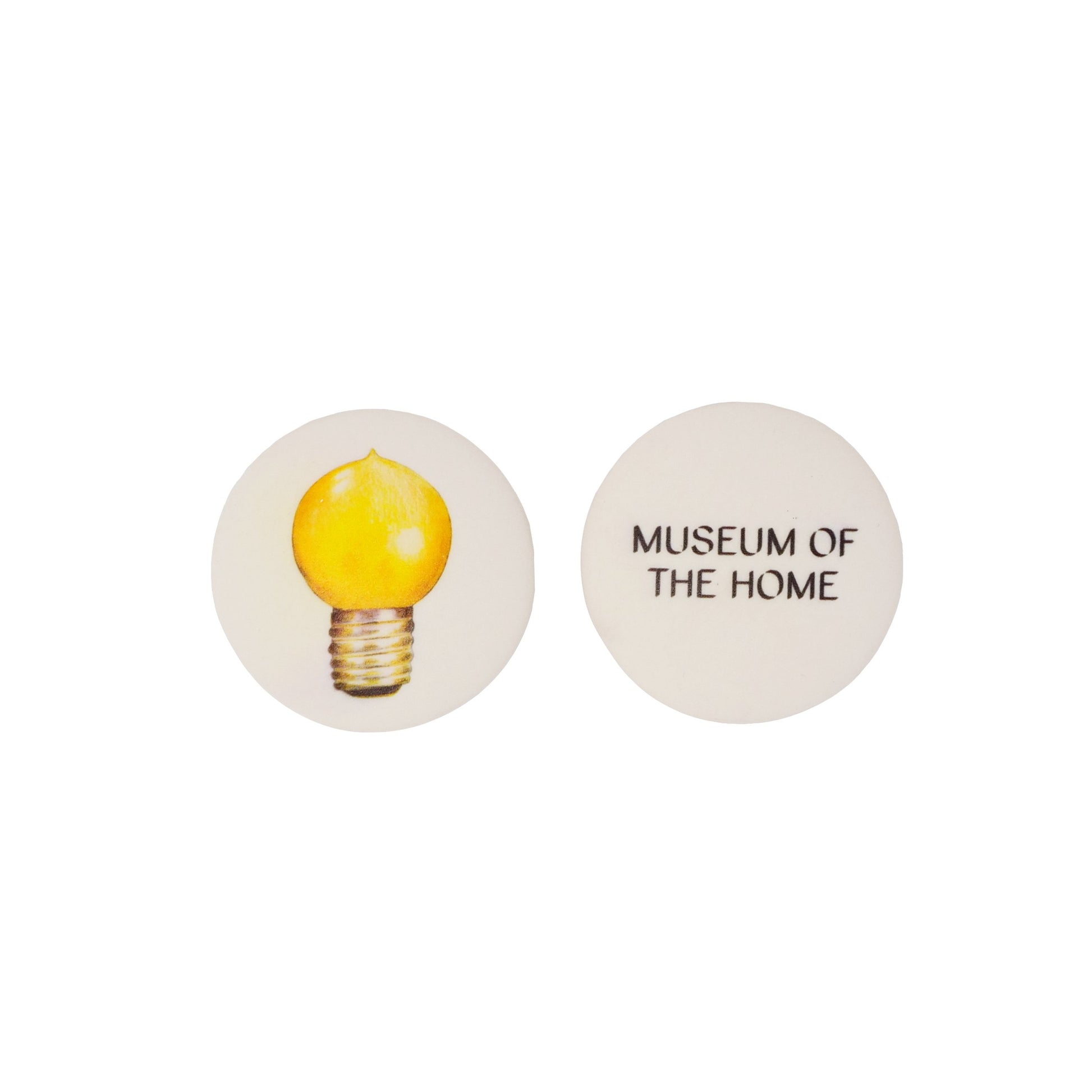 2 lightbulb erasers showing the back and front. Eraser on the left shows a lightbulb, eraser on the right shows the museum of the home logo in black lettering.