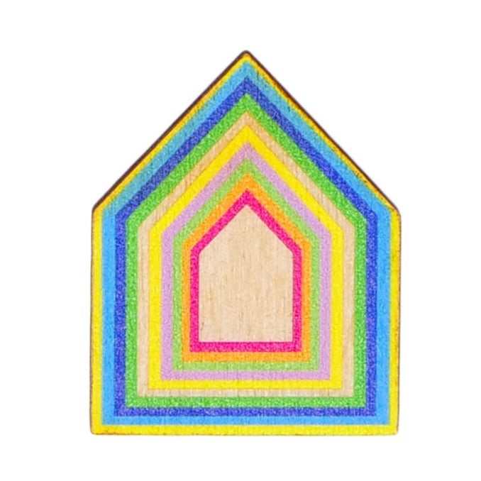 Wooden brooch in the shape of a house with colourful borders.