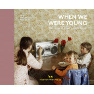 Copy of When We Were Young by Lee Shulman. Cover shows 3 children sat at midcentury table and a silver radio. Behind them is floral wallpaper in cream and yellow. The left of the cover is a light pink.