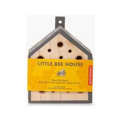 A wooden house for bees with grey roof.