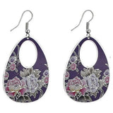 Oval shaped purple earrings with pink and grey flowers.