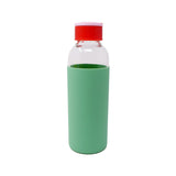 A glass water bottle with a mint silicone protector and a red lid on a white background.