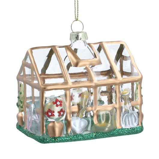 A bauble of a greenhouse with golden and green details.