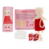 The content of the Kitty sewing kit including cat felt pieces, plastic needle, thread, stuffing and instructions.