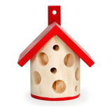 A wooden beetle house with a red roof and small holes for the beetles to live in.