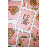 Luck postcards showing illustrations of a cat, a flower, a frog and a bird.
