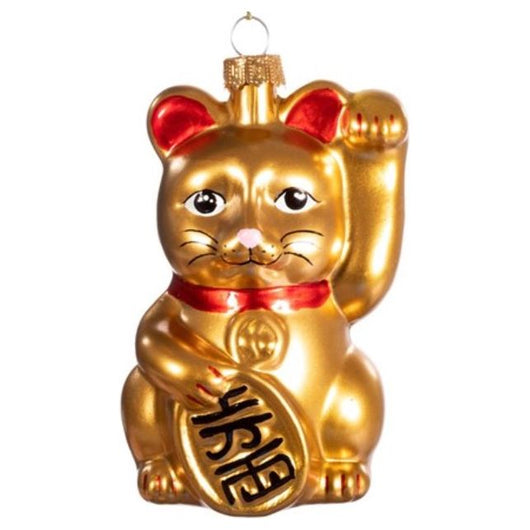 A golden bauble of a lucky cat. The cat is holding a sign with Chinese words and wearing a red collar. Its paw is lifted and its ears are red.