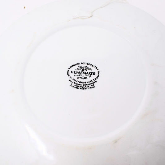 White ceramic plate with 'Homemaker' branding on a white background