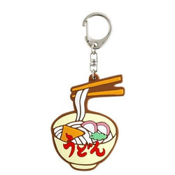 A keychain of a plastic bowl of noodles with chopsticks.