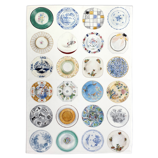 White tea towel with different plates printed on it. The tea towel is on a white background.