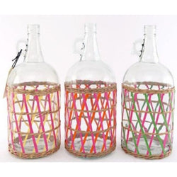 Three glass jars wrapped in colourful net.
