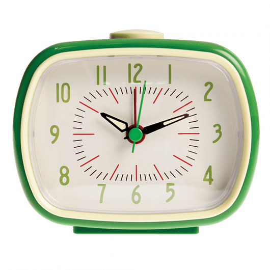 The front of a green retro alarm clock. The numbers are green and the clock hands are green. The background is cream and details are in red, green and black. The button to stop the alarm is cream.