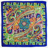 A unfolded blue scarf with details in green, yellow, red, white, black and pink.