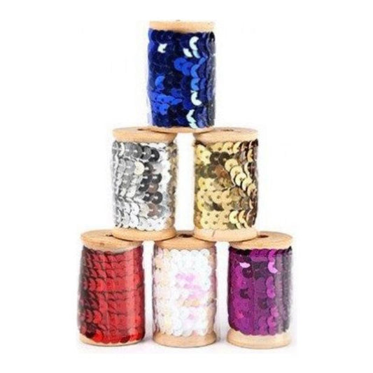 Six sequin ribbons on top of each other forming a pyramid on a white background. The ribbons are colour blue, silver, golden, red, litmus and purple.