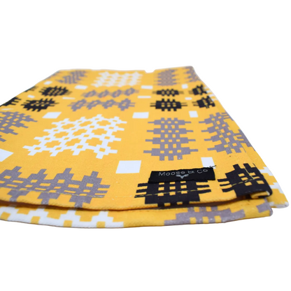 Folded fabric with geometric patterns on a white background
