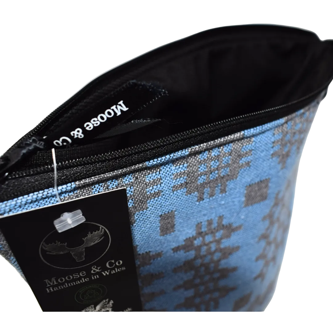 Blue patterned pouch with black zipper and Moose & Co label on a white background