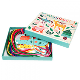 An open box with a stitching set. Inside the box there are colourful strings in green, pink, red, yellow and navy blue as well as the animal cards.