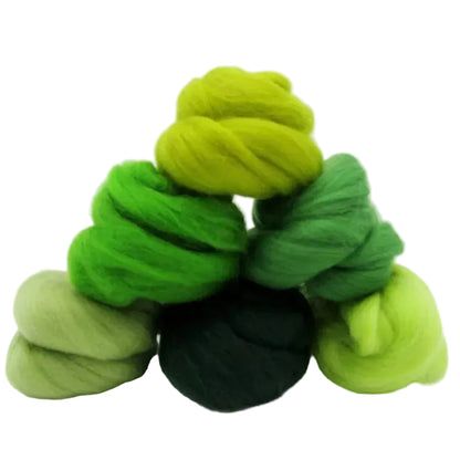 Bundles of green yarn on a white background