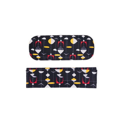 Closed glasses case with cloth neatly folded infront of it. 