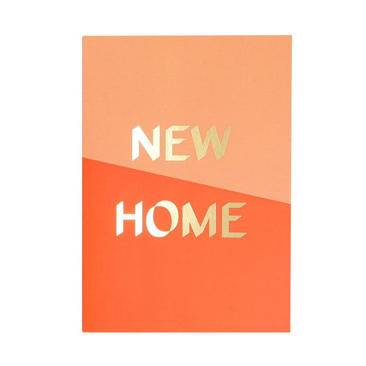 Greeting card with half peach and half orange background, separated diagonally. Has 'New Home' in gold foiled lettering. 
