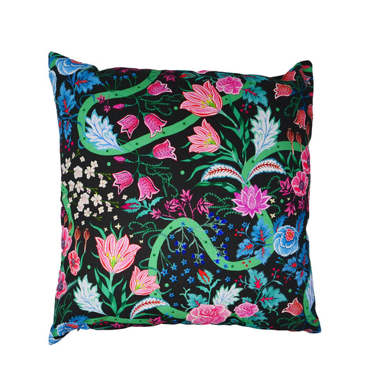Cushion cover with black background and flowers in blue, white, red and shades of pink with green stems and swirled lines. 
