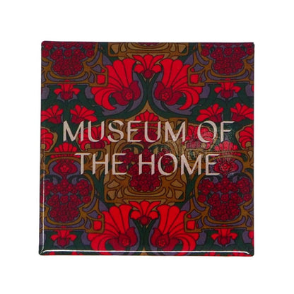 Red, orange and mauve patterned magnet with Museum of the Home logo in white writing.