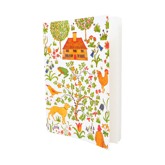A5 exercise book in The House That Jack Built print. The print is in an illustrative style and shows a house, animals and plants in orange and green against a white background. 