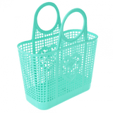 An aqua blue plastic bag with round handles. The basket got open squares and a heart shaped detail in the middle. The basket is on the side.