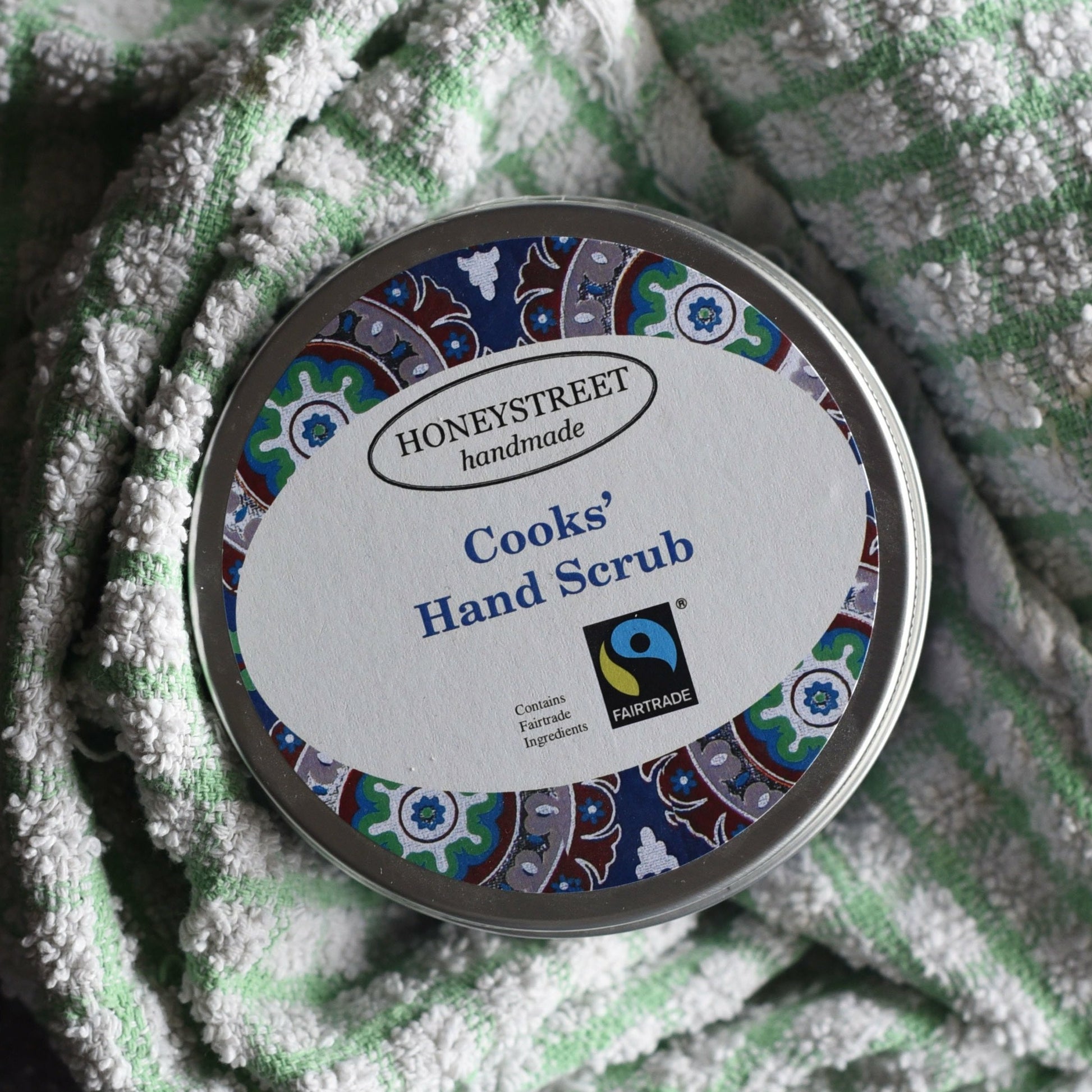 Cooks' hand scrub. Label reads "Honeystreet handmade" and features a fairtrade sticker.