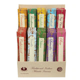 A variety of scented incense in variety of colours. Label reads 'traditional Indian Masala Incense' and a fair trade label can be seen. 