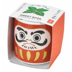 A Sweet Basil Cultivation kit. Comes on a red vase with a face illustrated. 