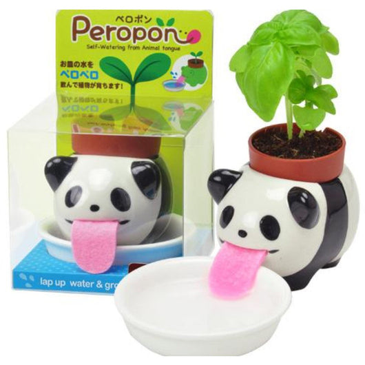 A self-watering flower pot. It is a small panda with its tongue out that serves as suction to water the plant. The plant sits on the panda's back.