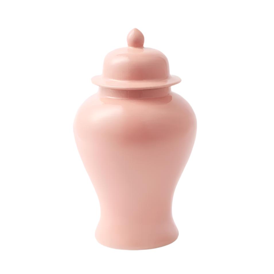 On a white background, a pink ginger jar sits in the middle with a same color lid.