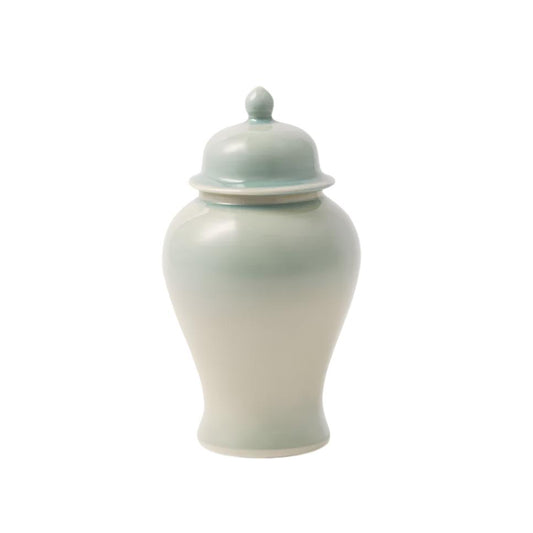 On a white background, a spearmint jar sits in the middle with a same color lid.